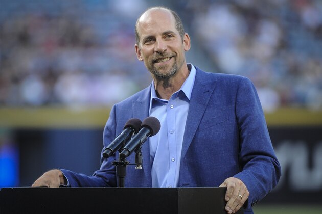Former Atlanta Braves pitcher John Smoltz is honored for his induction into the Baseball Hall of Fame before the start of a baseball game against the Arizona Diamondbacks, Friday, August 14, 2015, in Atlanta. (AP Photo/John Amis)
