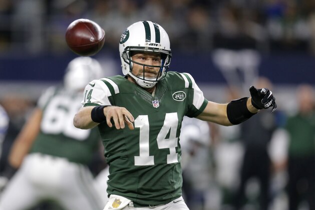 New York Jets quarterback Ryan Fitzpatrick (14) throws a pass against the Dallas Cowboys in the first half of an NFL football game, Saturday, Dec. 19, 2015, in Arlington, Texas. (AP Photo/Brandon Wade)