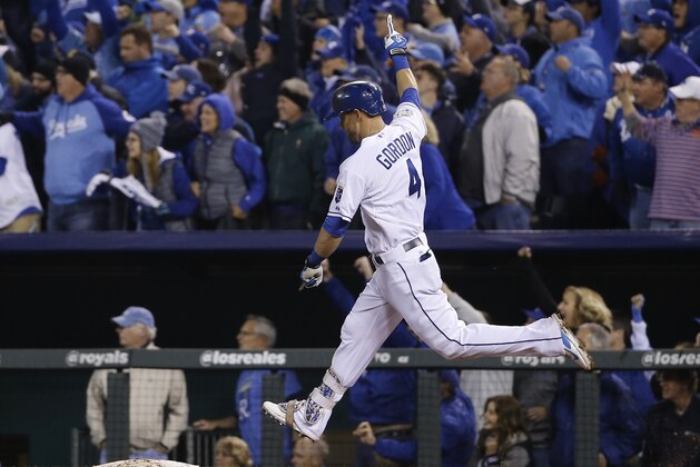 Kansas City Royals' Alex Gordon celebrates after hitting a solo home run during the ninth inning of Game 1 of the Major League Baseball World Series against the New York Mets Tuesday, Oct. 27, 2015, in Kansas City, Mo. (AP Photo/Matt Slocum)