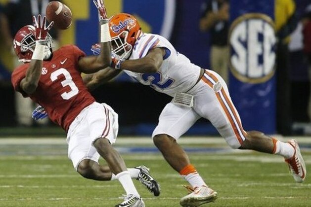 Alabama wide receiver Calvin Ridley (3) makes a catch against Florida defensive back Keanu Neal (42) during the second half of the Southeastern Conference championship NCAA college football game, Saturday, Dec. 5, 2015, in Atlanta. (AP Photo/John Bazemore)