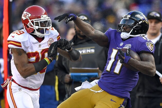 Kansas City Chiefs free safety Eric Berry, left, pushes Baltimore Ravens wide receiver Kamar Aiken out of bounds in the first half of an NFL football game, Sunday, Dec. 20, 2015, in Baltimore. (AP Photo/Nick Wass)
