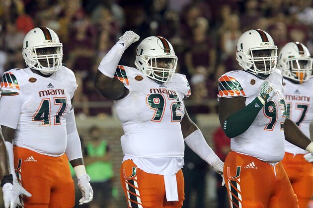Miami's defensive line, from left, Ufomba Kamalu, Courtel Jenkins, and Calvin Heurtelou rally their fans during an NCAA college football game with Florida State, Saturday, Oct. 10, 2015 in Tallahassee, Fla. Florida State won the game 29-24. (AP Photo/Steve Cannon) Miami's defensive line, from left, Ufomba Kamalu, Courtel Jenkins, and Calvin Heurtelou rally their fans during an NCAA college football game with Florida State, Saturday, Oct. 10, 2015 in Tallahassee, Fla. Florida State won the game 29-24. (AP Photo/Steve Cannon)