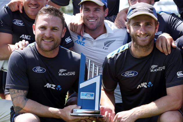 Brendon McCullum (L) and Kane Williamson (R) of New Zealand hold the trophy after day four of the second Test cricket match between New Zealand and Sri Lanka at Seddon Park in Hamilton on December 21, 2015. AFP PHOTO / MICHAEL BRADLEY / AFP / MICHAEL BRADLEY        (Photo credit should read MICHAEL BRADLEY/AFP/Getty Images)