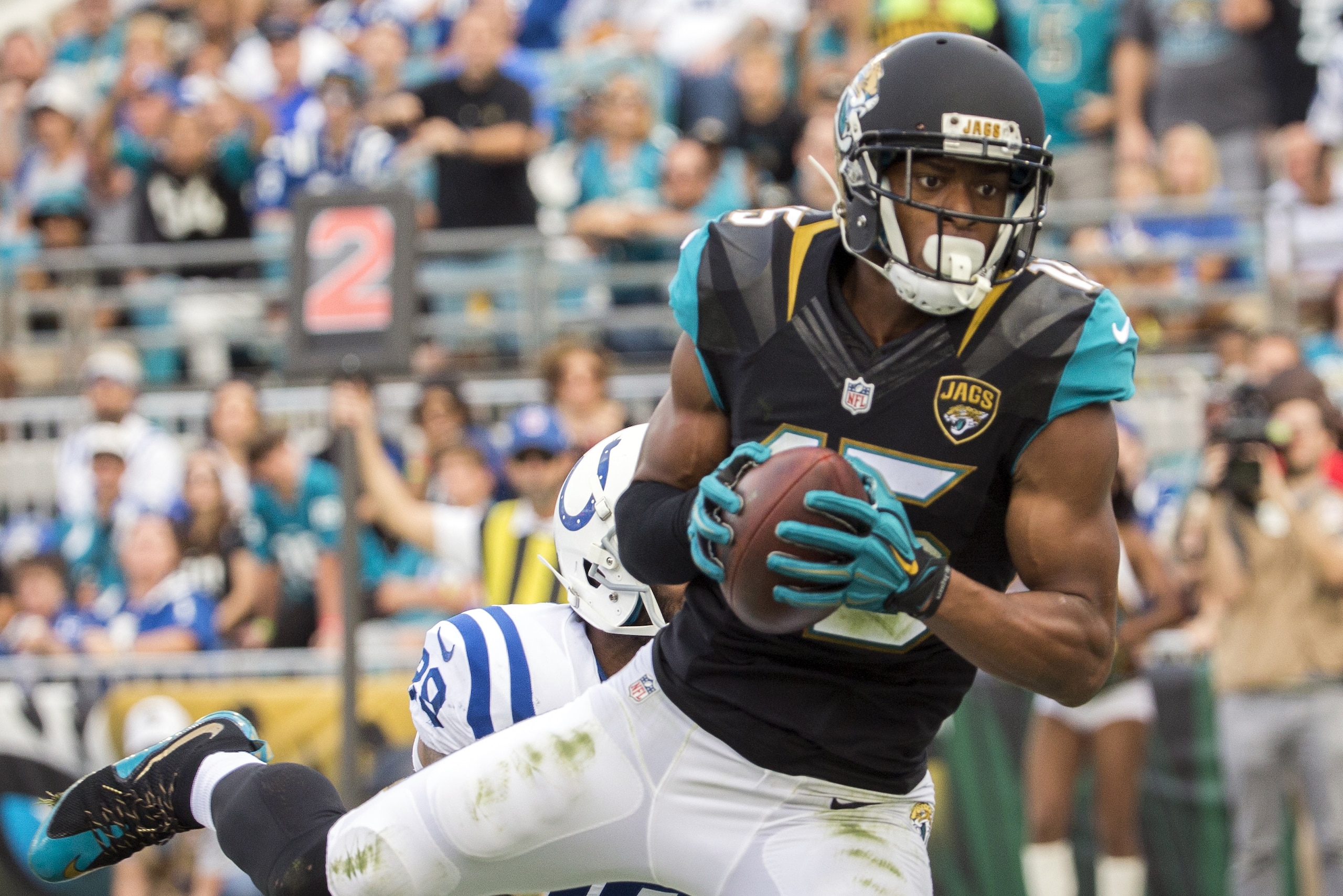 Jacksonville Jaguars wide receiver Allen Robinson, right, catches a 4-yard pass in front of Indianapolis Colts strong safety Mike Adams, left, during the second half of an NFL football game in Jacksonville, Fla., Sunday, Dec. 13, 2015. Jacksonville defeated the Colts 51-16. (AP Photo/Stephen B. Morton)