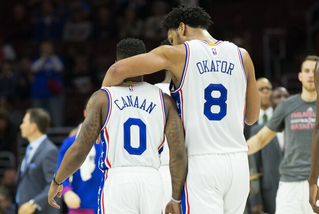 Dec 22, 2015; Philadelphia, PA, USA; Philadelphia 76ers center Jahlil Okafor (8) and guard Isaiah Canaan (0) walk back to the bench for a timeout after a missed shot against the Memphis Grizzlies during the second quarter at Wells Fargo Center. Mandatory Credit: Bill Streicher-USA TODAY Sports