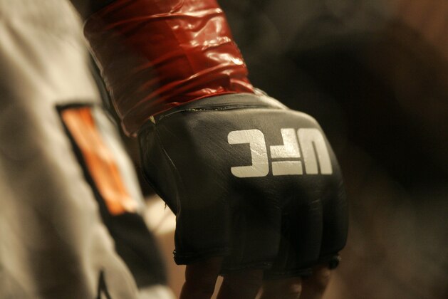 Closeup of a glove and the UFC logo at Ultimate Fighting Championship 73 on Saturday, July 7, 2007, in Sacramento, Calif.  (AP Photo/Jeff Chiu)
