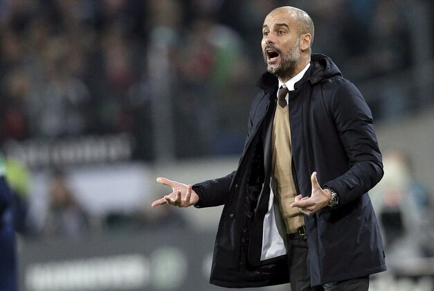 Bayern head coach pep Guardiola, gestures during the German Bundesliga soccer match between Hannover 96 and FC Bayern Munich in Hannover, Germany, Saturday, Dec. 19, 2015. Munich defeated Hannover by 1-0. (AP Photo/Michael Sohn)