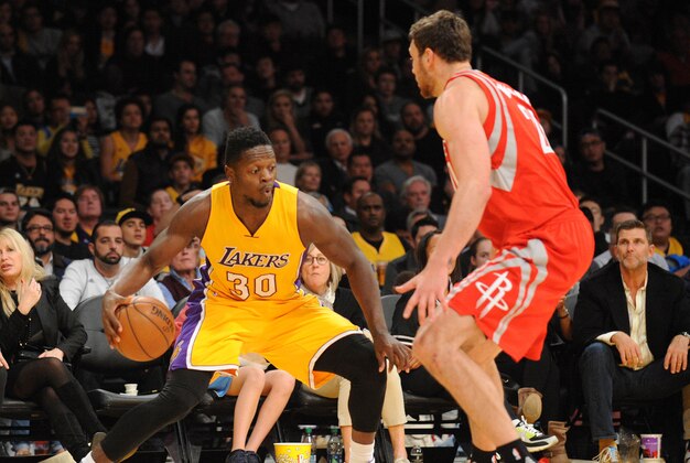 December 17, 2015; Los Angeles, CA, USA; Los Angeles Lakers forward Julius Randle (30) moves the ball against Houston Rockets forward Donatas Motiejunas (20) during the second half at Staples Center. Mandatory Credit: Gary A. Vasquez-USA TODAY Sports