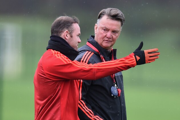 MANCHESTER, ENGLAND - NOVEMBER 24:  Wayne Rooney (L) and Louis van Gaal manager of Manchester United in discussion during the Manchester United training session on the eve of the UEFA Champions League Group B match against PSV Eindhoven at Aon Training Complex on November 24, 2015 in Manchester, England.  (Photo by Michael Regan/Getty Images)