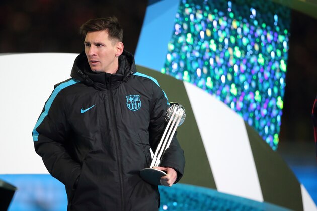 YOKOHAMA, JAPAN - DECEMBER 20:  Lionel Messi of FC Barcelona holding the Adidas Silver Ball Trophy  during the FIFA Club World Cup Final Match between FC Barcelona and River Plate at International Stadium Yokohama on December 20, 2015 in Yokohama, Japan.  (Photo by Matthew Ashton - AMA/Getty Images)