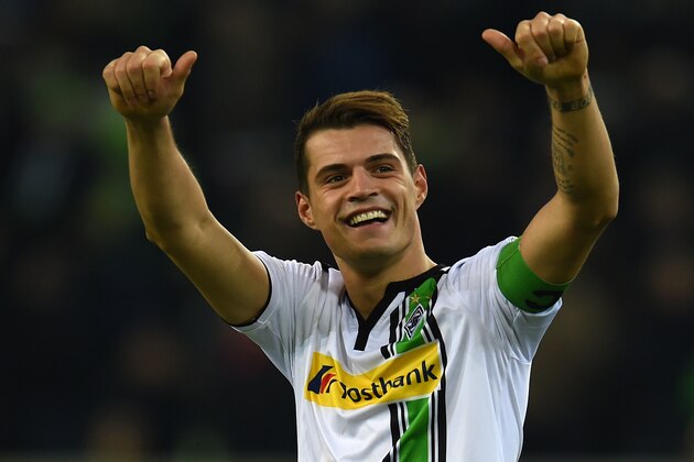 Moenchengladbach's Swiss midfielder Granit Xhaka celebrates after the German first division Bundesliga football match Moenchengladbach vs Bayern Munich in Moenchengladbach on December 5, 2015.  
 / AFP / PATRIK STOLLARZ        (Photo credit should read PATRIK STOLLARZ/AFP/Getty Images)