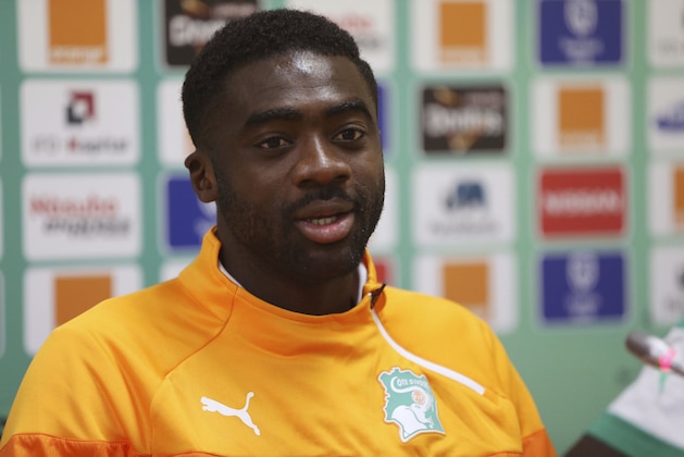 FILE-In this file photo taken on Tuesday, Jan. 27, 2015, Ivory Coast soccer player, Kolo Toure, speaks during a press conference in Malabo, Equatorial Guinea.  Ivory Coast will still be in celebration mode on its return to action after winning the African Cup of Nations, giving one final call-up to retired pair Boubacar Barry and Kolo Toure to allow them to go out in front of their home crowd. (AP Photo/Sunday Alamba, File)