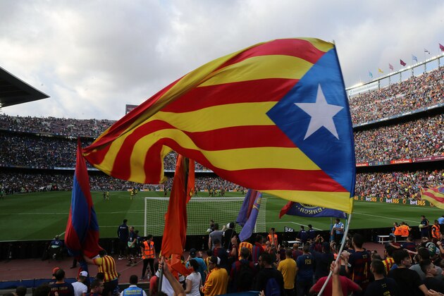 Barcelona's supporters wave the 'Estelada', pro-independent Catalonia flag, during the Spanish league football match FC Barcelona vs UD Las Palmas at the Camp Nou stadium in Barcelona on September 26, 2015. AFP PHOTO / CESAR MANSO        (Photo credit should read CESAR MANSO/AFP/Getty Images)