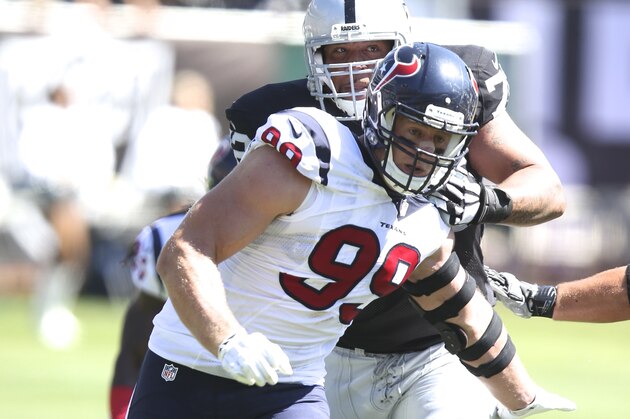 Houston Texans DE #99 JJ Watt action in the second quarter in a game against the Oakland Raiders at the O.co Coliseum at an NFL game in Oakland, Calif. on Sunday Sept. 14, 2014. (AP Photo/David Seelig)