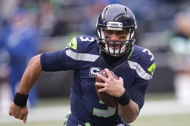 Seattle Seahawks quarterback Russell Wilson scrambles in the first half of an NFL football game against the Cleveland Browns, Sunday, Dec. 20, 2015, in Seattle. (AP Photo/Scott Eklund)