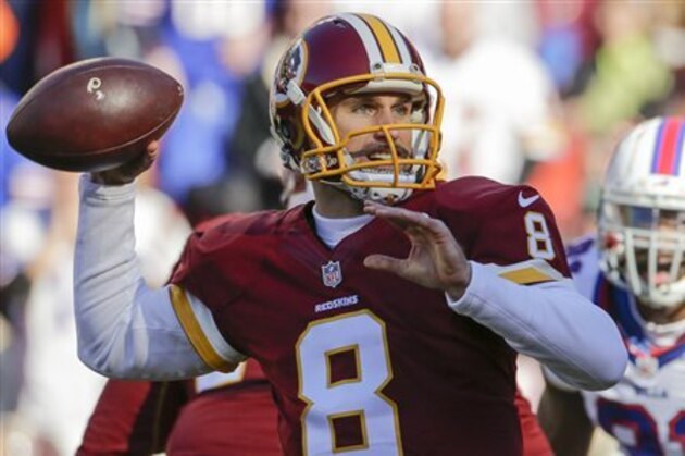 In this Dec. 20, 2015, photo, Washington Redskins quarterback Kirk Cousins (8) passes the ball during the first half of an NFL football game against the Buffalo Bills in Landover, Md. Forget about complicated playoff permutations. It's suddenly all become so simple for the Washington Redskins: Win their game against the Philadelphia Eagles next weekend, and coach Jay Gruden's club will clinch the NFC East title. (AP Photo/Mark Tenally)
