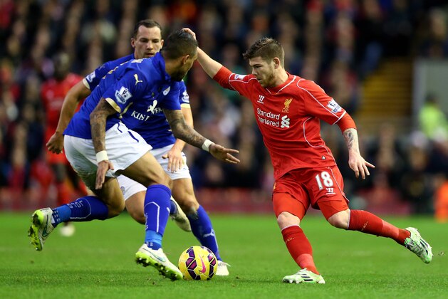 LIVERPOOL, ENGLAND - JANUARY 01:  Alberto Moreno of Liverpool is tackled by Danny Simpson of Leicester City during the Barclays Premier League match between Liverpool and Leicester City at Anfield on January 1, 2015 in Liverpool, England.  (Photo by Clive Brunskill/Getty Images)