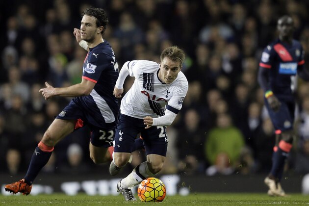 Tottenham’s Christian Eriksen, right, gets away from  Newcastle’s Daryl Janmaat during the English Premier League soccer match between Tottenham Hotspur and Newcastle United at White Hart Lane in London, Sunday Dec. 13, 2015. (AP Photo/Tim Ireland)