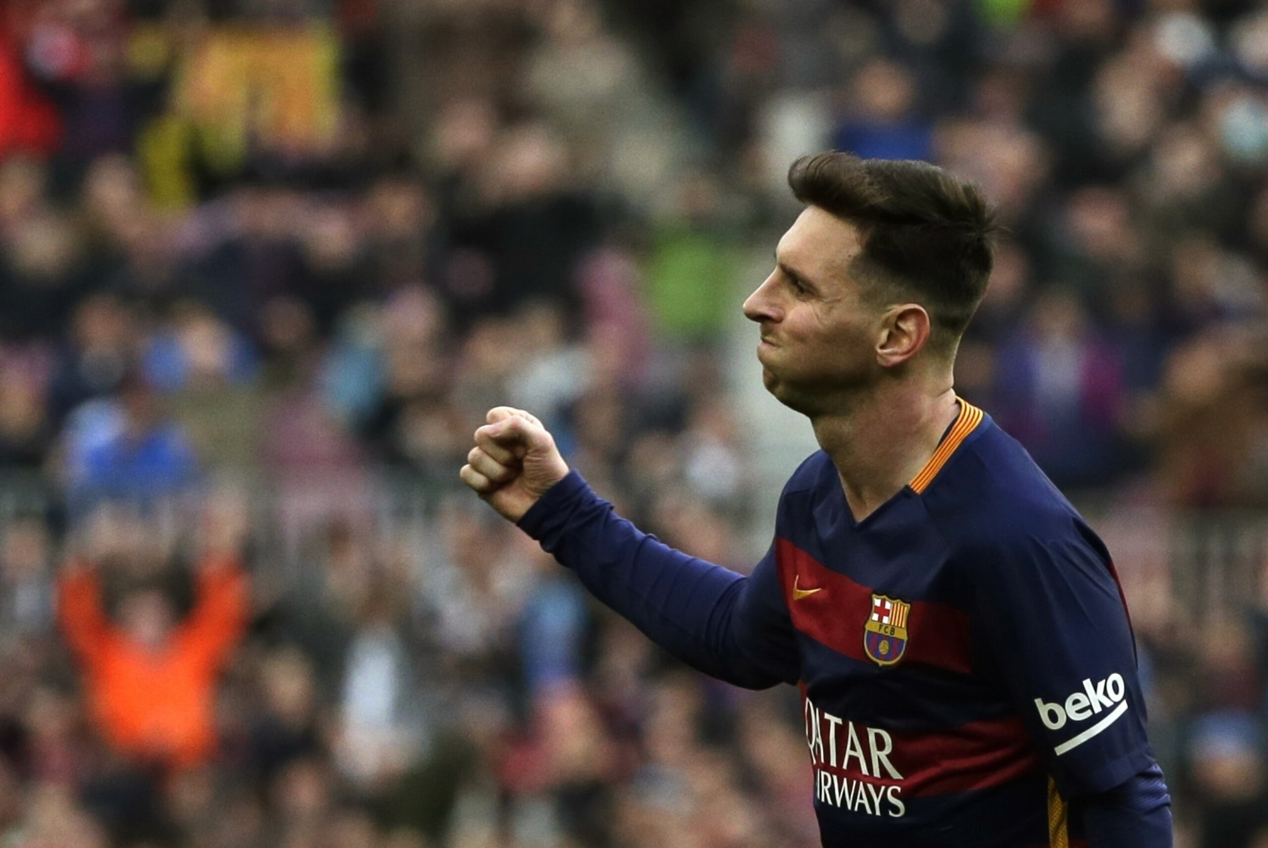 Barcelona's Lionel Messi celebrates scoring the opening goal during a Spanish La Liga soccer match between FC Barcelona and Deportivo Coruna at the Camp Nou stadium in Barcelona, Spain, Saturday, Dec. 12, 2015. (AP Photo/ Emilio Morenatti)