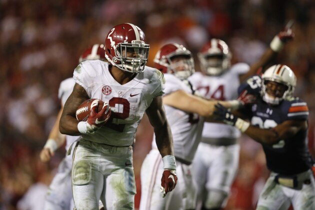 Alabama running back Derrick Henry (2) runs the ball and scores a touchdown during the second half of an NCAA college football game, Saturday, Nov. 28, 2015, in Auburn, Ala. Alabama won 29-13. (AP Photo/Gerald Herbert)