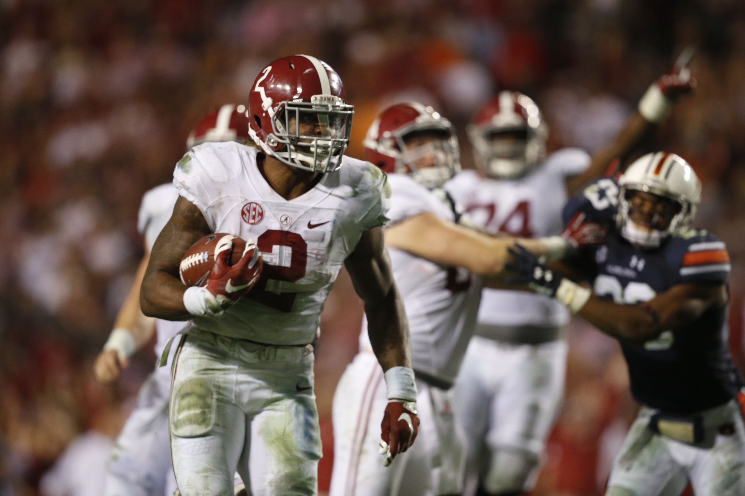 Alabama running back Derrick Henry (2) runs the ball and scores a touchdown during the second half of an NCAA college football game, Saturday, Nov. 28, 2015, in Auburn, Ala. Alabama won 29-13. (AP Photo/Gerald Herbert)