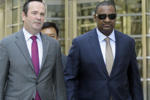 Former FIFA vice president Jeffrey Webb, right, leaves Brooklyn federal court with his attorney Edward O'Callaghan, Friday, Aug. 14, 2015, in New York. Webb is one of 14 people indicted in May in the U.S. Justice Department's investigation into corruption at FIFA. (AP Photo/Mary Altaffer)