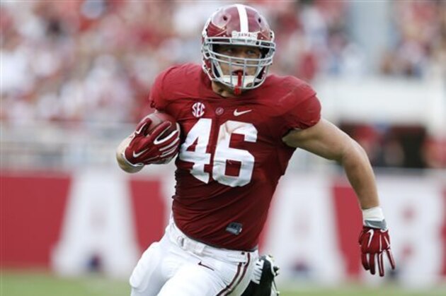FILE - In this Sept. 26, 2015, file photo, Alabama tight end Michael Nysewander (46) runs with the ball during the first half of an NCAA college football game in Tuscaloosa, Ala. Michael Nysewander is the guy in front of the guy, blocking for Alabama tailback Derrick Henry in short yardage situations. The former walk on is also a big hitter on special teams for the third-ranked Crimson Tide, earning a scholarship and carving out a low-key role on a roster full of stars. (AP Photo/Jonathan Bachman, File)