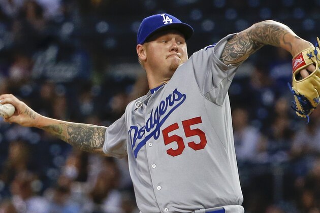 Los Angeles Dodgers starting pitcher Mat Latos works against the San Diego Padres during the first inning of a baseball game Thursday, Sept. 3, 2015, in San Diego. (AP Photo/Lenny Ignelzi)