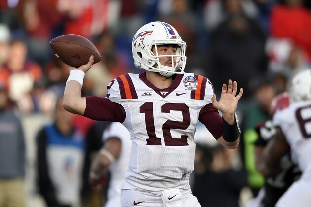 Virginia Tech quarterback Michael Brewer (12) looks to pass against the Cincinnati during the second half of the Military Bowl NCAA college football game, Saturday, Dec. 27, 2014, in Annapolis, Md. Virginia Tech won 33-17. (AP Photo/Nick Wass)