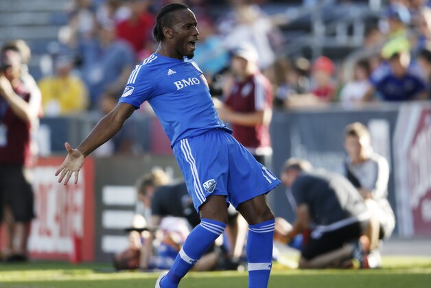 Montreal Impact forward Didier Drogba celebrates after making penalty kick against Colorado Rapids in the first half of an MLS soccer match in Commerce City, Colo., Saturday, Oct. 10, 2015. (AP Photo/David Zalubowski)