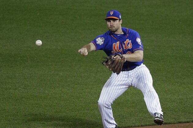 New York Mets second baseman Daniel Murphy throws to second on a double play on a hit by Kansas City Royals' Alcides Escobar during the third inning of Game 5 of the Major League Baseball World Series Sunday, Nov. 1, 2015, in New York. (AP Photo/Julie Jacobson)