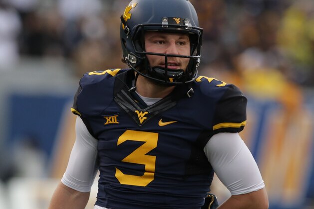 West Virginia quarterback Skyler Howard (3) during the first half/ second half of an NCAA college football game, Saturday, Nov. 28, 2015, in Morgantown, W.Va. (AP Photo/Raymond Thompson)