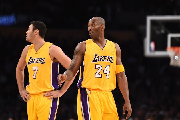 Kobe Bryant (24) and Larry Nance Jr (7) of the Los Angeles Lakers look on between points against Toronto Raptors  during their NBA match up, November 20, 2015 at Staples Center in Los Angeles, California. AFP PHOTO / ROBYN BECK        (Photo credit should read ROBYN BECK/AFP/Getty Images)