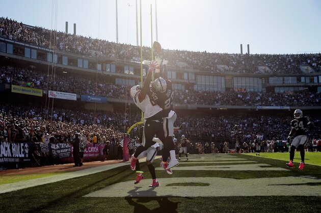 OAKLAND, CA - OCTOBER 12:  Tarell Brown #23 of the Oakland Raiders breaks up a pass intended for Antonio Gates #85 of the San Diego Chargers at O.co Coliseum on October 12, 2014 in Oakland, California.  (Photo by Ezra Shaw/Getty Images)