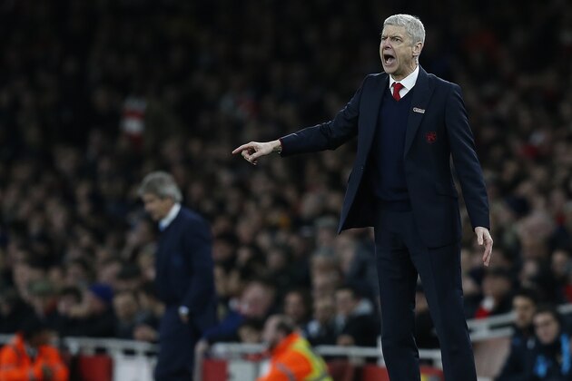 Arsenal's French manager Arsene Wenger (R) and Manchester City's Chilean manager Manuel Pellegrini watch their players from the touchline during the English Premier League football match between Arsenal and Manchester City at the Emirates Stadium in London on December 21, 2015. AFP PHOTO / IKIMAGES

RESTRICTED TO EDITORIAL USE. No use with unauthorised audio, video, data, fixture lists, club/league logos or 'live' services. Online in-match use limited to 45 images, no video emulation. No use in betting, games or single club/league/player publications. / AFP / IKIMAGES / IKIMAGES        (Photo credit should read IKIMAGES/AFP/Getty Images)