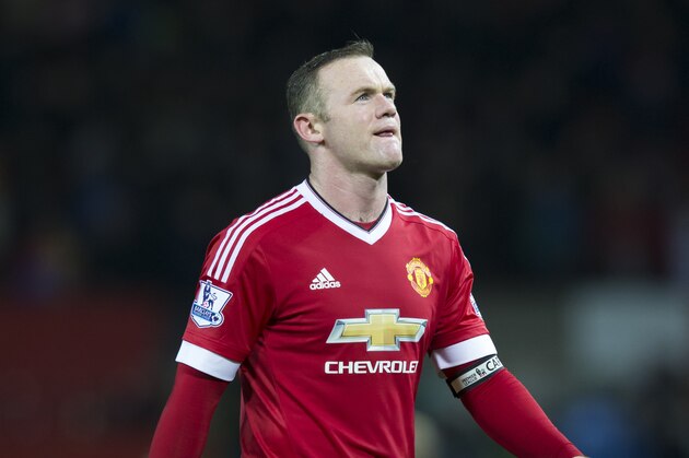 Manchester United's Wayne Rooney makes his way from the pitch after his team's 2-1 loss to Norwich City in the English Premier League soccer match between Manchester United and Norwich City at Old Trafford Stadium, Manchester, England, Saturday, Dec. 19, 2015. (AP Photo/Jon Super)