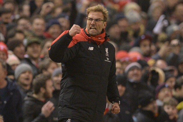 Liverpool's German manager Jurgen Klopp celebrates their late equalising goal to level the score at 2-2 the English Premier League football match between Liverpool and West Bromwich Albion at Anfield in Liverpool, northwest England, on December 13, 2015.  AFP PHOTO / OLI SCARFF

RESTRICTED TO EDITORIAL USE. No use with unauthorized audio, video, data, fixture lists, club/league logos or 'live' services. Online in-match use limited to 75 images, no video emulation. No use in betting, games or single club/league/player publications. / AFP / OLI SCARFF        (Photo credit should read OLI SCARFF/AFP/Getty Images)