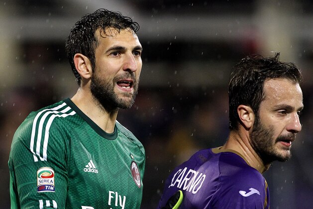AC Milan goalkeeper Diego Lopez, left, and Fiorentina's Alberto Gilardino stand on the pitch during a Serie A soccer match at the Artemio Franchi stadium in Florence, Italy, Monday, March 16, 2015. (AP Photo/Fabrizio Giovannozzi) AC Milan goalkeeper Diego Lopez, left, and Fiorentina's Alberto Gilardino stand on the pitch during a Serie A soccer match at the Artemio Franchi stadium in Florence, Italy, Monday, March 16, 2015. (AP Photo/Fabrizio Giovannozzi)