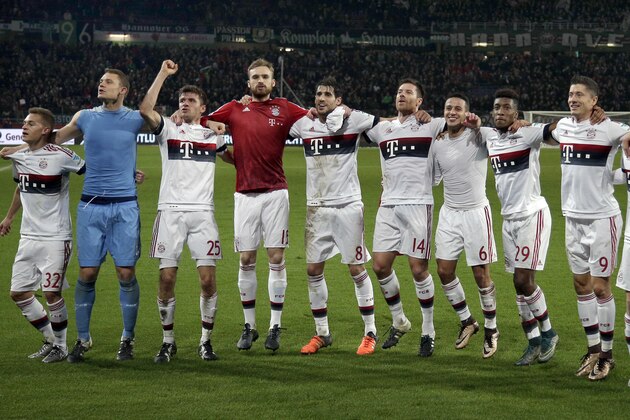 Munich's players celebrate after  the German Bundesliga soccer match between Hannover 96 and FC Bayern Munich in Hannover, Germany, Saturday, Dec. 19, 2015. Munich defeated Hannover by 1-0. (AP Photo/Michael Sohn)