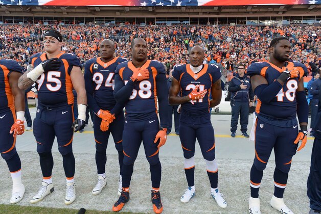 Dec 13, 2015; Denver, CO, USA; Denver Broncos defensive end Derek Wolfe (95) and outside linebacker DeMarcus Ware (94) and outside linebacker Von Miller (58) and cornerback Aqib Talib (21) and outside linebacker Shaquil Barrett (48) before the game against the Oakland Raiders at Sports Authority Field at Mile High. Mandatory Credit: Ron Chenoy-USA TODAY Sports