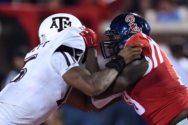 OXFORD, MS - OCTOBER 24:  Myles Garrett #15 of the Texas A&M Aggies works against Laremy Tunsil #78 of the Mississippi Rebels during a game at Vaught-Hemingway Stadium on October 24, 2015 in Oxford, Mississippi. Mississippi defeated Texas A&M 23-3.  (Photo by Stacy Revere/Getty Images)
