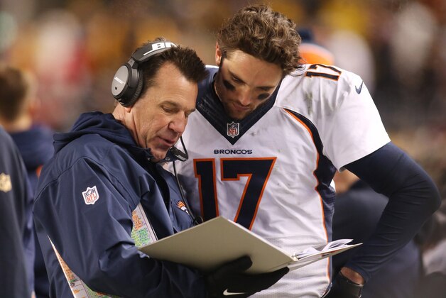 Dec 20, 2015; Pittsburgh, PA, USA; Denver Broncos head coach Gary Kubiak (L) talks with quarterback Brock Osweiler (17) on the sidelines against the Pittsburgh Steelers during the fourth quarter at Heinz Field. The Steelers won 34-27. Mandatory Credit: Charles LeClaire-USA TODAY Sports
