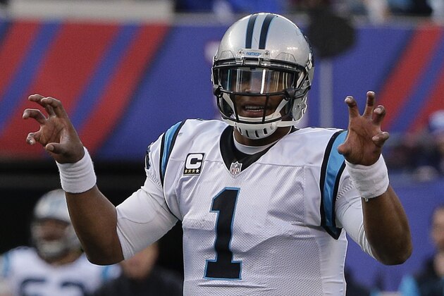 Carolina Panthers quarterback Cam Newton calls an audible at the line of scrimmage during the second half of an NFL football game against the New York Giants, Sunday, Dec. 20, 2015, in East Rutherford, N.J. (AP Photo/Julie Jacobson)