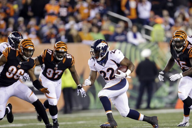 Denver Broncos running back C.J. Anderson (22) runs against the Cincinnati Bengals during the first half of an NFL football game Monday, Dec. 22, 2014, in Cincinnati. (AP Photo/AJ Mast)