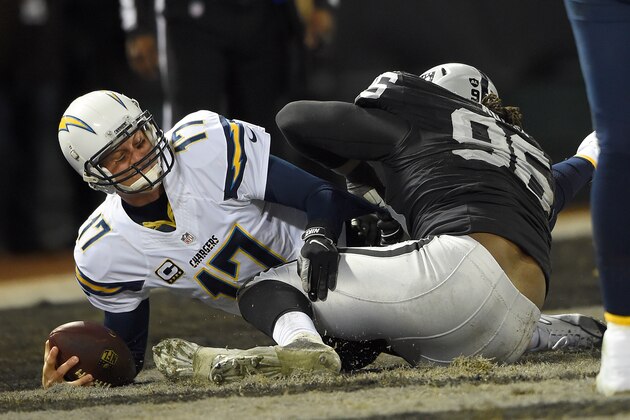 OAKLAND, CA - DECEMBER 24:  Philip Rivers #17 of the San Diego Chargers gets sacked in the endzone for a safety by Denico Autry #96 of the Oakland Raiders in the third quarter of their NFL game at O.co Coliseum on December 24, 2015 in Oakland, California.  (Photo by Thearon W. Henderson/Getty Images)