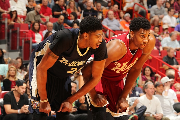 MIAMI, FL - DECEMBER 25:  Anthony Davis #23 of the New Orleans Pelicans boxes out against Hassan Whiteside #21 of the Miami Heat on December 25, 2015 at American Airlines Arena in Miami, Florida. NOTE TO USER: User expressly acknowledges and agrees that, by downloading and or using this Photograph, user is consenting to the terms and conditions of the Getty Images License Agreement. Mandatory Copyright Notice: Copyright 2015 NBAE (Photo by Issac Baldizon/NBAE via Getty Images)
