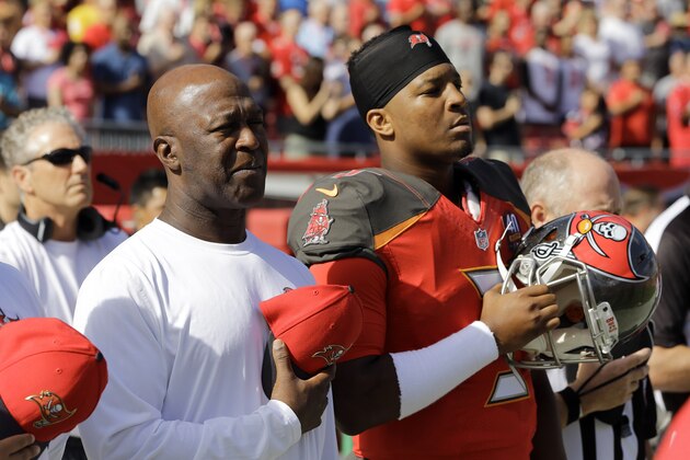Tampa Bay Buccaneers head coach Lovie Smith, left, and quarterback Jameis Winston (3) during the playing of the National Anthm before an NFL football game against the Atlanta Falcons Sunday, Dec. 6, 2015, in Tampa, Fla. (AP Photo/Chris O'Meara)