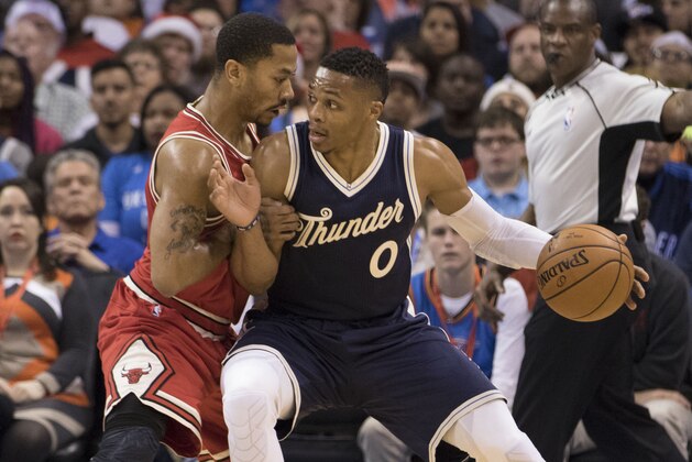 OKLAHOMA CITY, OK - DECEMBER 25: Derrick Rose #1 of the Chicago Bulls applies pressure as Russell Westbrook #0 of the Oklahoma City Thunder looks for a shot during the first quarter of a NBA game at the Chesapeake Energy Arena on December 25, 2015 in Oklahoma City, Oklahoma. NOTE TO USER: User expressly acknowledges and agrees that, by downloading and or using this photograph, User is consenting to the terms and conditions of the Getty Images License Agreement. (Photo by J Pat Carter/Getty Images)