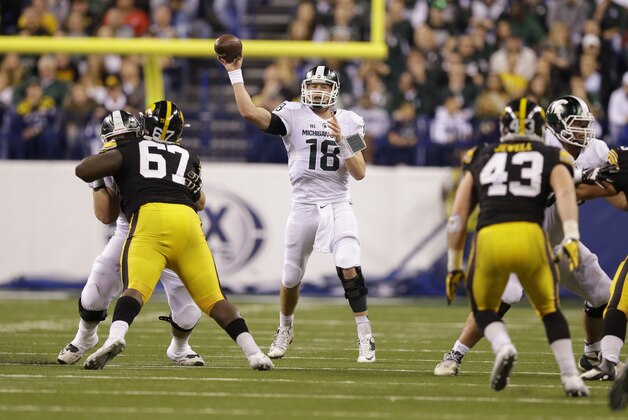 Michigan State quarterback Connor Cook (18) throws during the second half of the Big Ten Conference championship NCAA college football game against Iowa, Saturday, Dec. 5, 2015, in Indianapolis. (AP Photo/Michael Conroy)