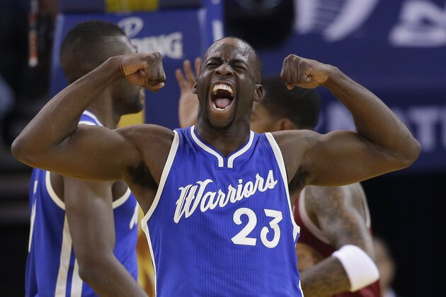 Golden State Warriors' Draymond Green (23) celebrates after scoring against the Cleveland Cavaliers during the first half of an NBA basketball game Friday, Dec. 25, 2015, in Oakland, Calif. (AP Photo/Marcio Jose Sanchez)